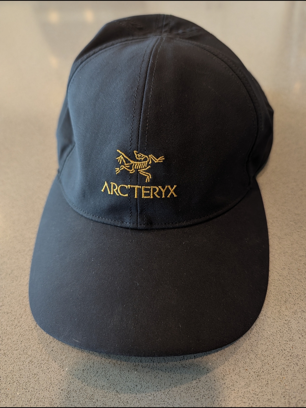 Arc'teryx Men's Black Logo Cap - Black/Gold Embroidery